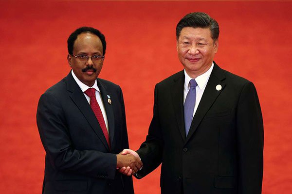 Somalia's President Mohamed Abdullahi Mohamed (left) shakes hands with China's President Xi Jinping during the Forum on China-Africa Cooperation at the Great Hall of the People in Beijing on September 3, 2018. Somalia is trying to restore good relations with the global community. PHOTO | ANDY WONG | AFP