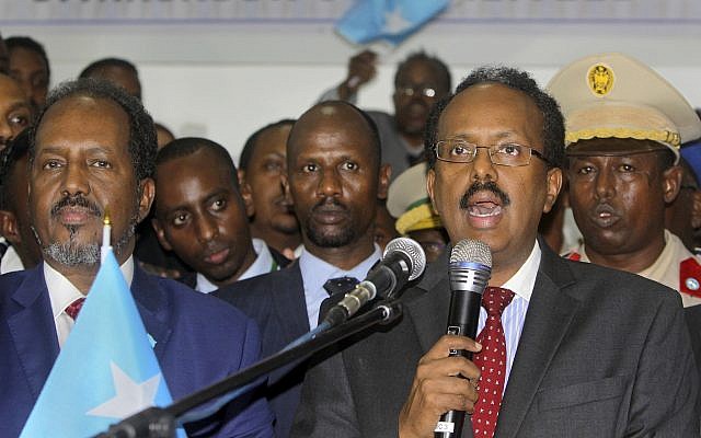 New Somali President Mohamed Abdullahi Farmajo, right, is joined by incumbent President Hassan Sheikh Mohamud, left, as he speaks to reporters after winning the election in Mogadishu, Somalia, February 8, 2017. (AP Photo/Farah Abdi Warsameh)