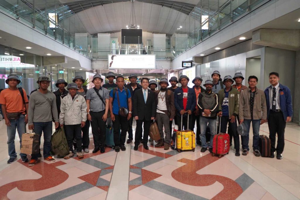 Members of a Thai fishing crew rescued from a boat off Somalia pose for a group photo on arrival in Bangkok on Monday. (Photo from @MFAThai Twitter account)