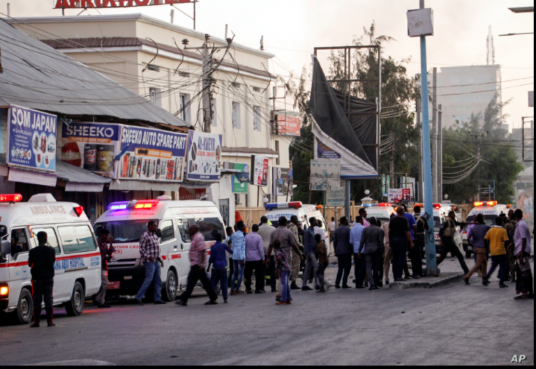 Ambulances and security forces gather on the street outside the Afrik hotel in the capital Mogadishu, Somalia, Jan. 31, 2021. CREDIT AP
