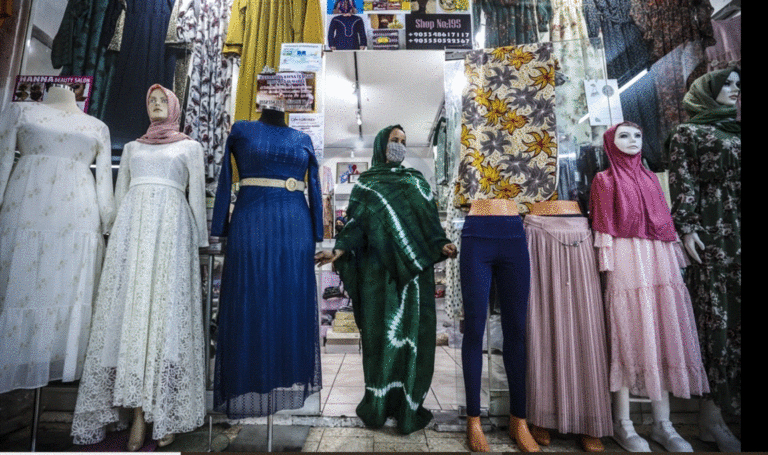 ANKARA, TURKEY - MARCH 31: A Somalian woman stands at a store in Turkish capital Ankara on March 31, 2021. In recent years, many Somalian entrepreneurs who have turned the increase in the number of Somalis living in the capital Ankara into an opportunity and added value to the city with their restaurants, cafes, barbers, hairdressers and markets. Compared to other cities, Ankara's transportation network is well developed, for this reason as well as being the capital city Ankara is preferred by Somalians. Somalians call the city the Mogadishu of Turkey. ( Esra Hacioğlu - Anadolu Agency )
