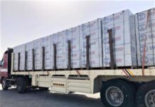 A truck loaded with heavy-duty plastic sheeting is prepared to make the trip to Tigray, Ethiopia, where an estimated 1 million people are displaced by conflict. Photo: OIM 2021