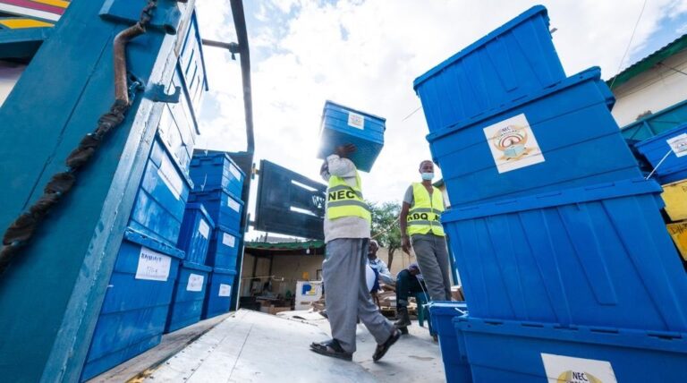 Officials of the electoral commission readying ballot boxes for distribution ahead of the election day. Photo credit: Richard Harper