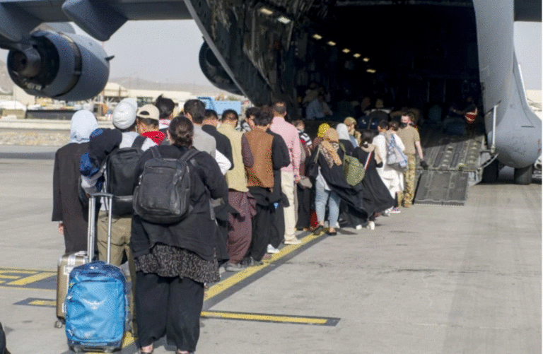 Evacuees stage before boarding a US C-17 Globemaster III [Nicholas Guevara/US Marine Corps/AFP]