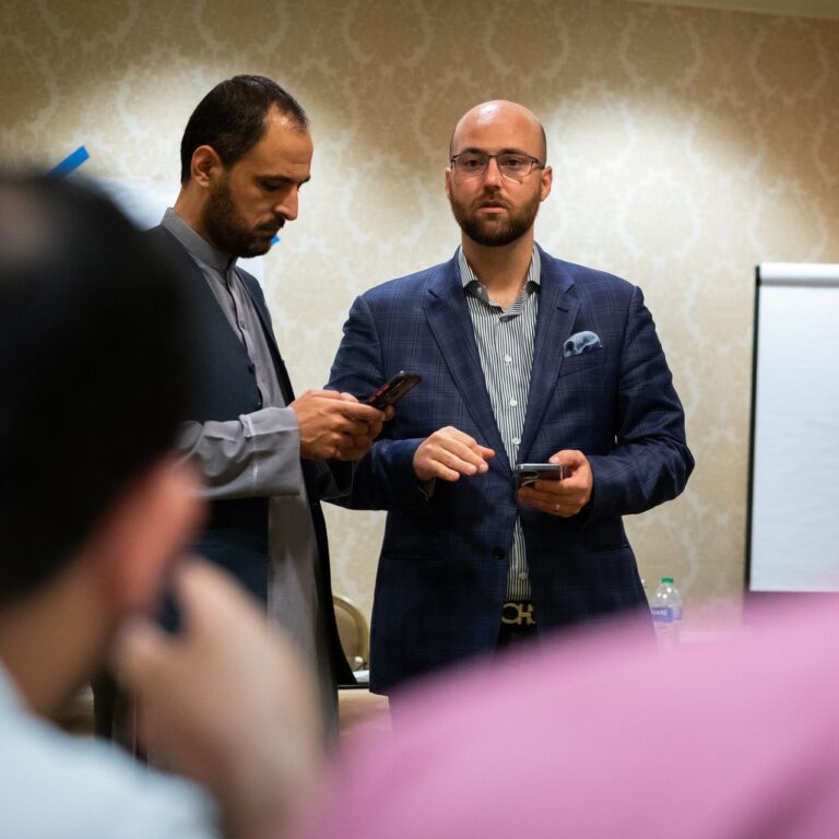 Afghanistan's deputy ambassador to Qatar, Barakat Rahmati, left, and Zach Van Meter at the Willard Hotel in Washington, working on rescue efforts in Afghanistan.