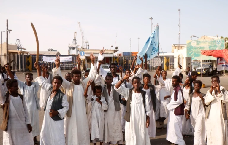 Sudanese protesters gather outside the main entrance to the southern port in Port Sudan [File: Ibrahim Ishaq/AFP