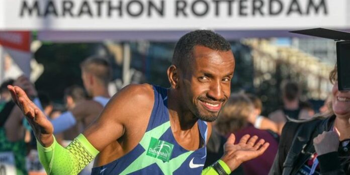 Somali-born Belgian Bashir Abdi celebrates at the finishing line after winning the 2021 Rotterdam Marathon. Photo credit: Courtesy