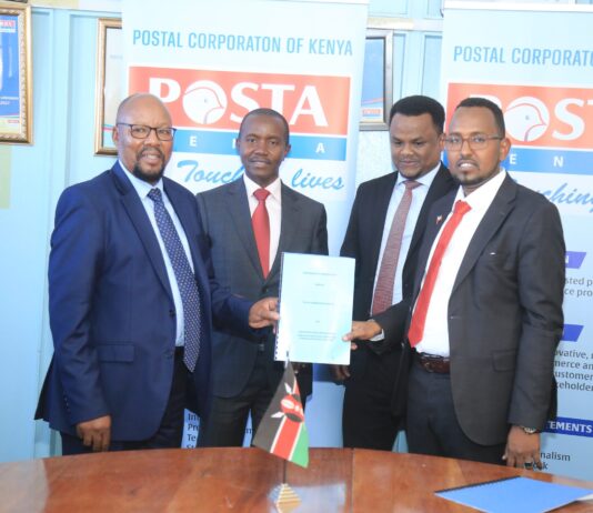 From left to right: Postal Corporation of Kenya Postmaster General Dan Kagwe, Cabinet Secretary for Information, Communication and Youth Affairs Joe Mucheru, Somaliland Deputy Ambassador to Kenya Sharmake Gele and Director General Somaliland Postal Services Yousouf Warsame soon after signing a Memorandum of Understanding between the two postal bodies. /COURTESY