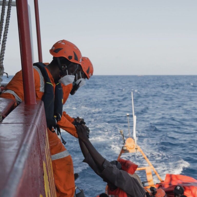 The crew of Sea-Eye 4 help migrants on to their boat in June, 2022 | Photo: Maria Maida 7 from Twitter feed: @seaeyeorg