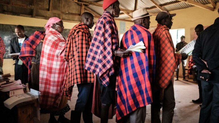 AFP Image caption, Voters queued since early in the morning at polling stations across Kenya