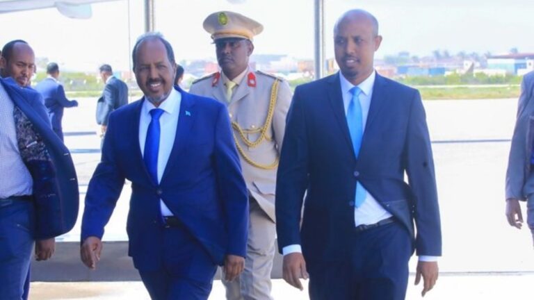Somali President Hassan Sheikh Mohamud (left) at the Aden Adde International Airport in Mogadishu, Somalia. PHOTO | VILLA SOMALIA