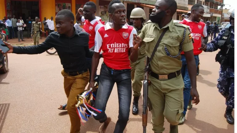 JACOBS ODONGO SEAMAN Image caption, One fan was carrying a symbolic trophy which they had bought at a store