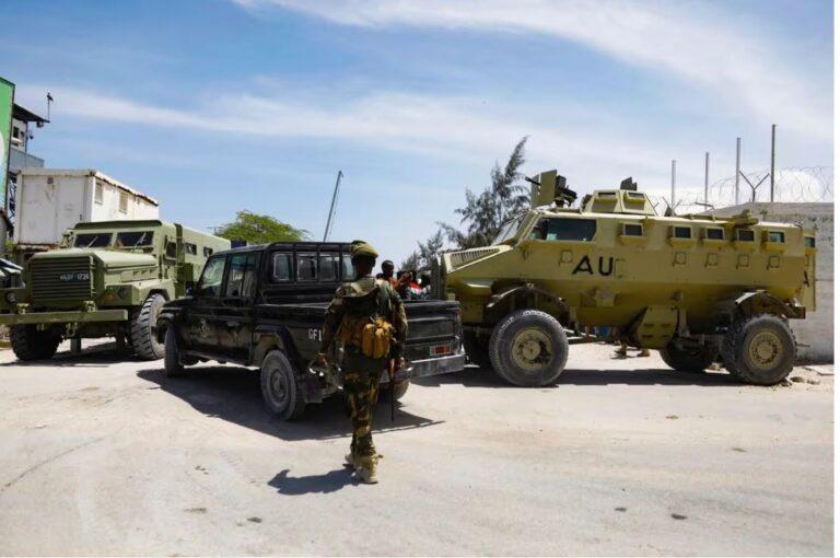 African Union peacekeepers stand next to armoured personnel carriers (APC) as they provide security for members of the Lower House of Parliament who are meeting to elect a speaker, at the Aden Adde International Airport in Mogadishu, Somalia, April 27, 2022. REUTERS/Feisal Omar/File Phot