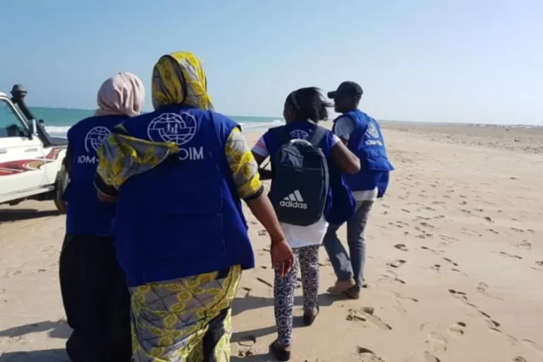 Rescuers search for survivors on the beach after two boats carrying migrants and refugees capsized off the shore near Godoria, in northeast Djibouti, in January 2019 [International Organization for Migration via AP]