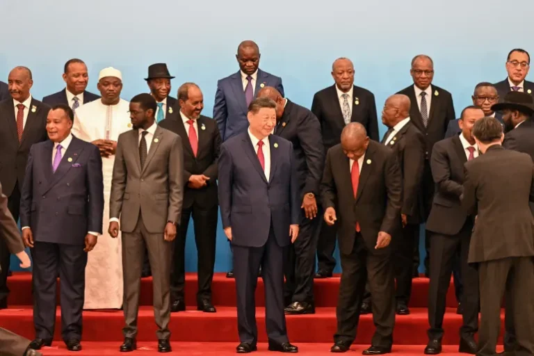 China's President Xi Jinping stands with leaders from African countries at the Forum on China-Africa Cooperation in Beijing, on September 5 [Adek Berry/AFP]