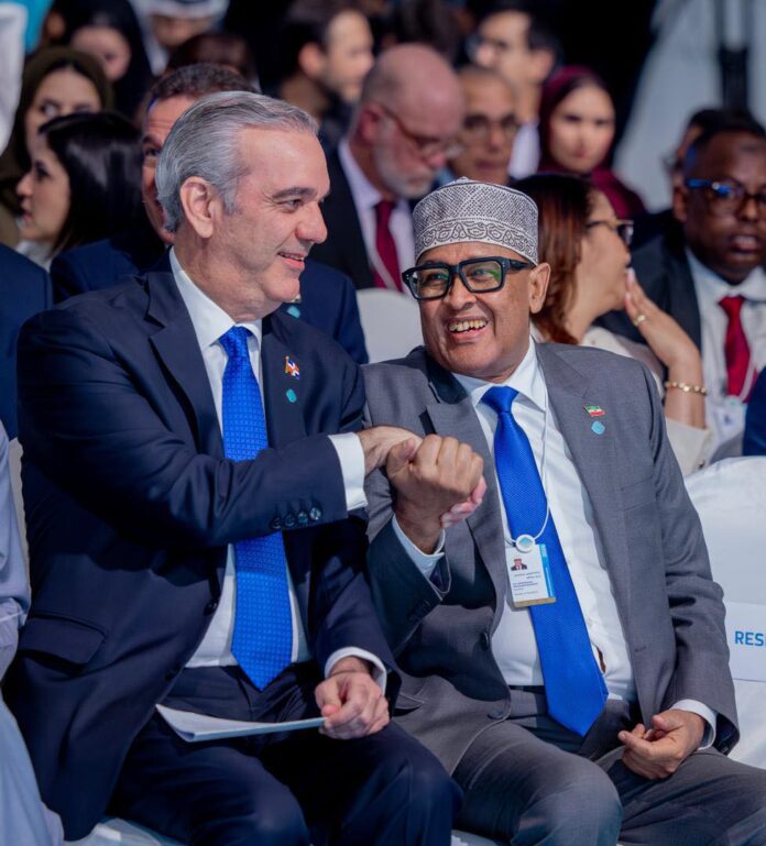Somaliland President Abdirahman Mohamed Abdilahi exchanges greetings with Dominican Republic President Luis Abinader inside the main conference hall during the World Governments Summit in Dubai.