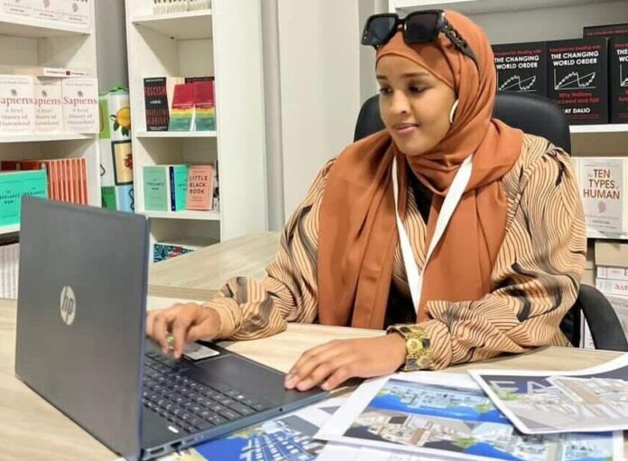At her office, Su’ad works on architectural plans, reflecting a growing demand for professional design services in Somaliland.