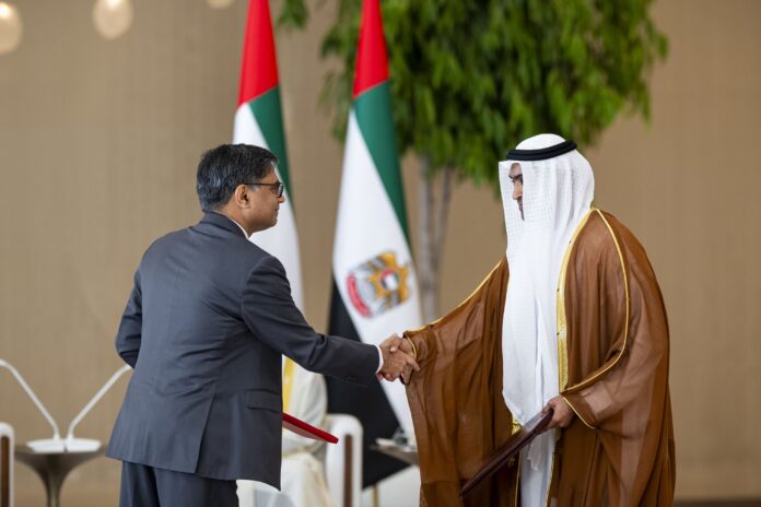 Officials from the United Arab Emirates and India exchange signed agreements during a ceremony in Abu Dhabi witnessed by Mohamed bin Zayed Al Nahyan and Narendra Modi. Photo by WAM. Officials from the United Arab Emirates and India exchange signed agreements during a ceremony in Abu Dhabi witnessed by Mohamed bin Zayed Al Nahyan and Narendra Modi. Photo by WAM.