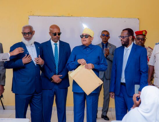 Somaliland President Abdirahman Mohamed Abdullahi Irro receives a briefing from education officials after officially launching the 2026 national certificate examinations at Farah Omar Secondary School in Hargeisa.