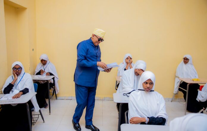 Somaliland President Abdirahman Mohamed Abdullahi Irro distributes national examination papers to students during the official launch of the 2026 Somaliland National Certificate Examinations at Farah Omar Secondary School in Hargeisa. A record 42,519 students are sitting this year's nationwide examinations.