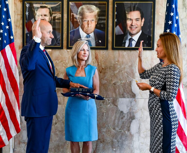 Bridget Bean holding the family Bible as her husband, Frank Garcia, was sworn in as Assistant Secretary of State for African Affairs. (Photo: State Department / Facebook)