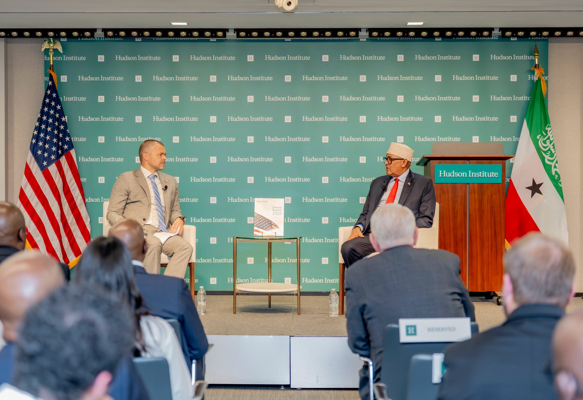 Somaliland President Abdirahman Mohamed Abdullahi participates in a discussion with Hudson Institute Senior Fellow Joshua Meservey following his keynote address in Washington. The U.S. and Somaliland flags are displayed on either side of the stage.