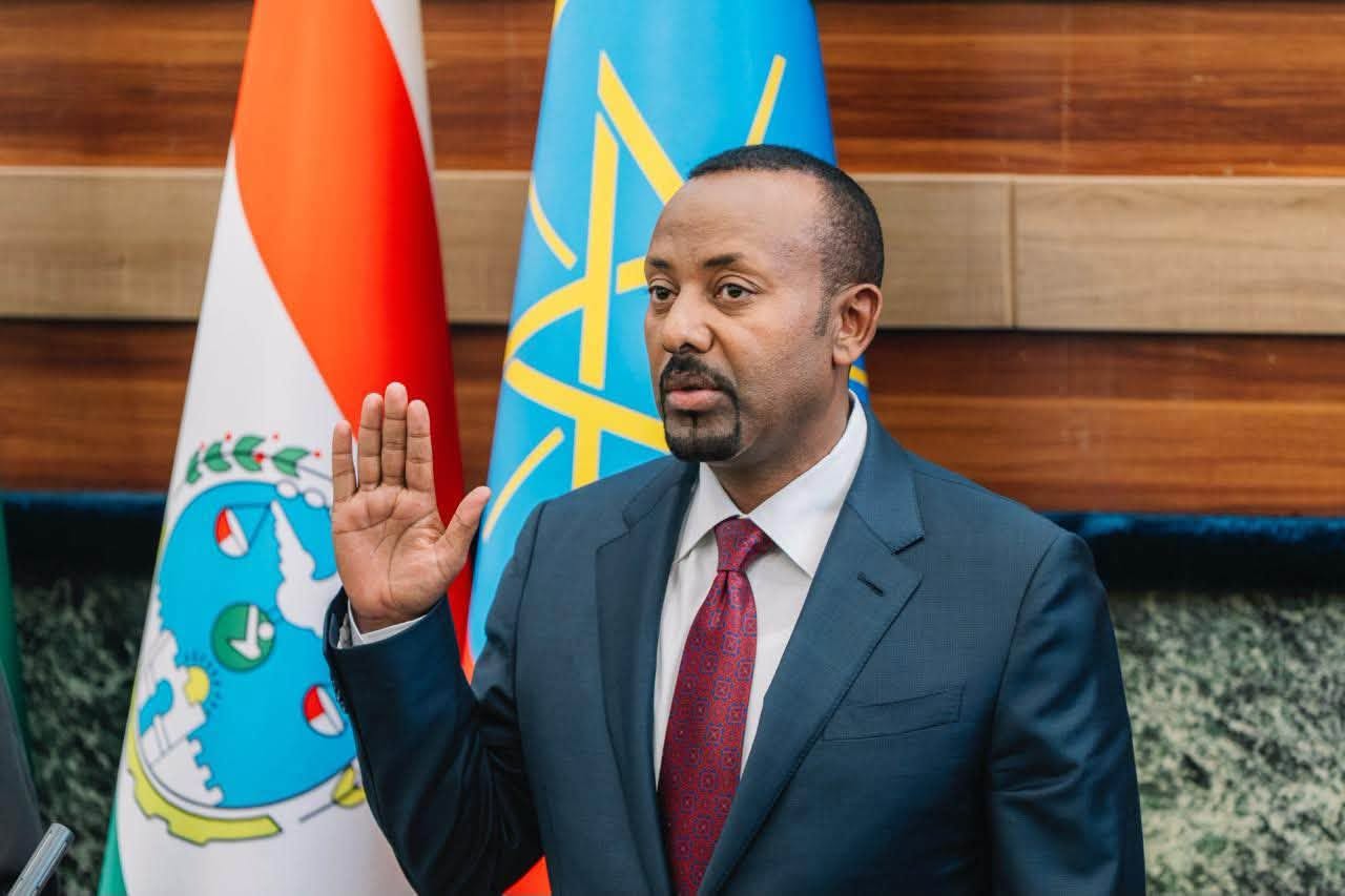 Ethiopian Prime Minister Abiy Ahmed raises his right hand as he takes the oath of office for a new five-year term in Addis Ababa, Ethiopia, October 5, 2026